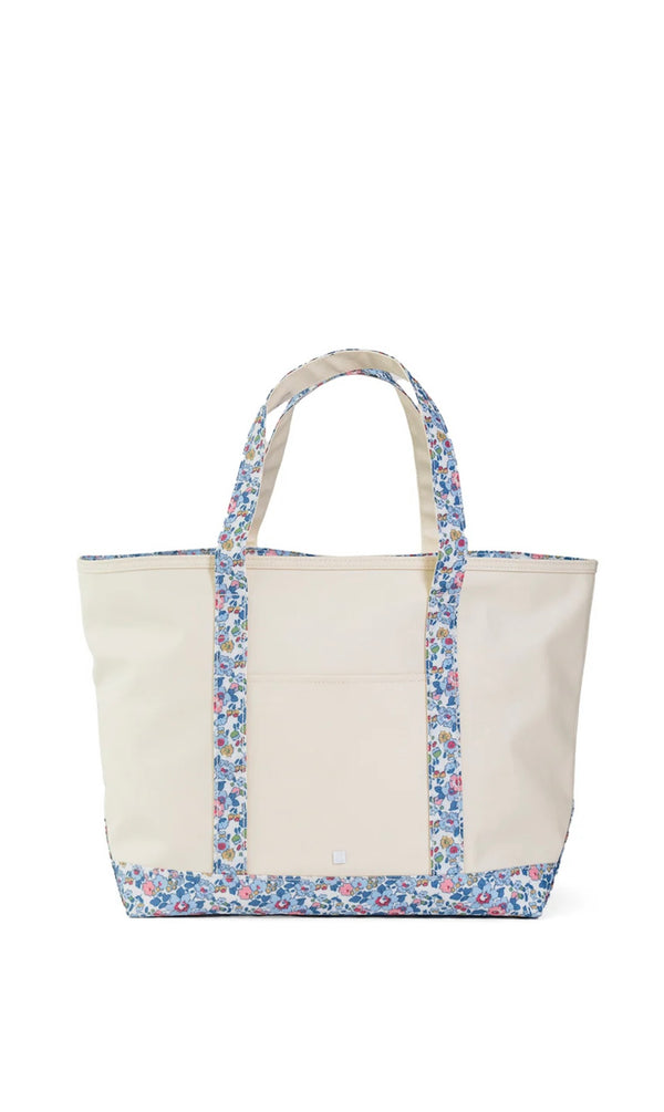 Beige tote bag with floral trim on a white background