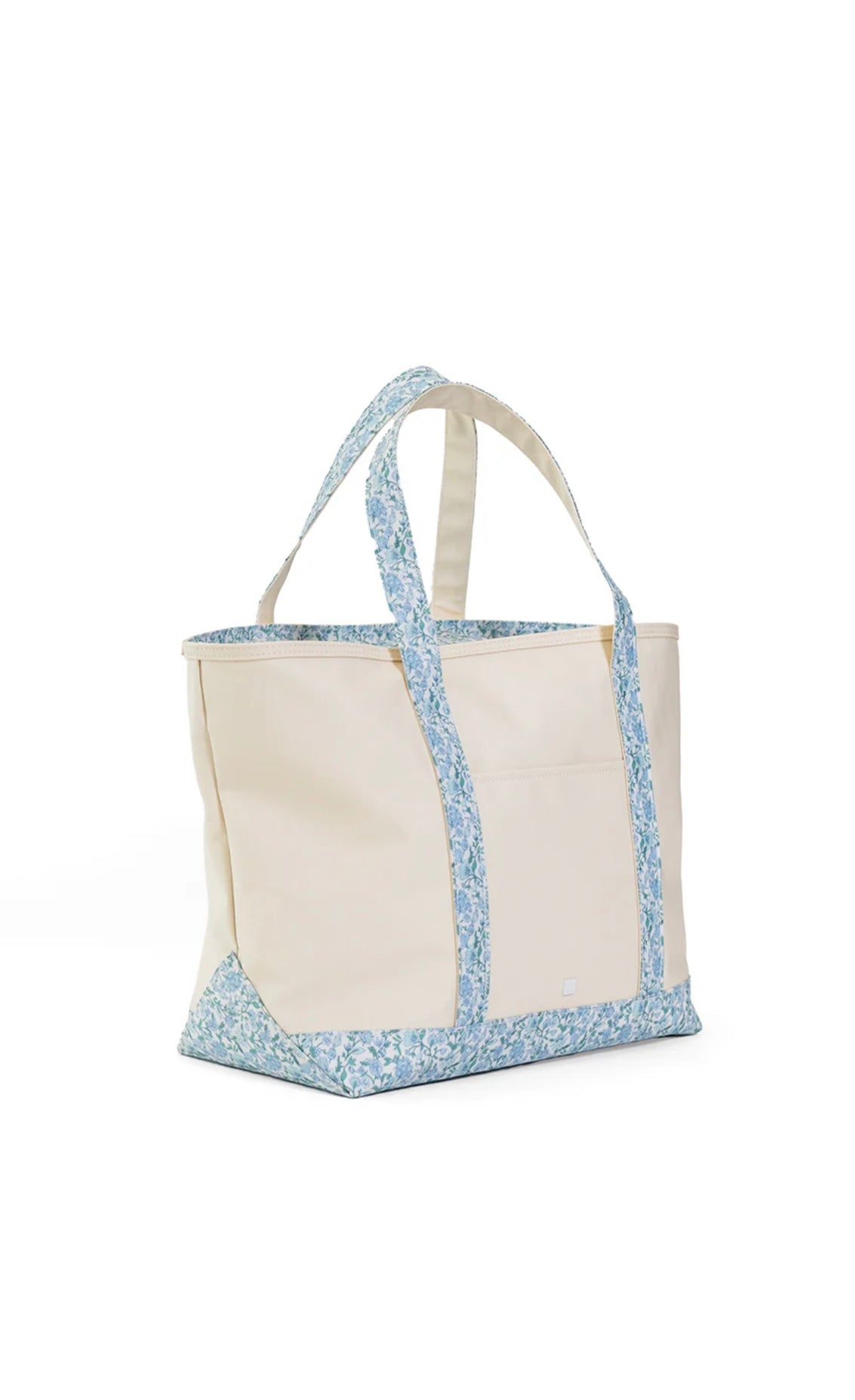 Tote bag with floral edge design on a white background