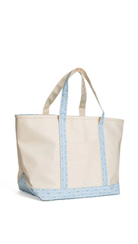 Natural coated canvas TRVL maxi tote with blue petite fleur floral trim