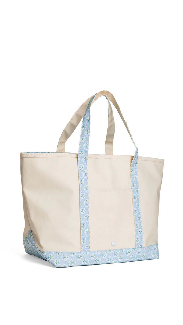 Natural coated canvas TRVL maxi tote with blue petite fleur floral trim