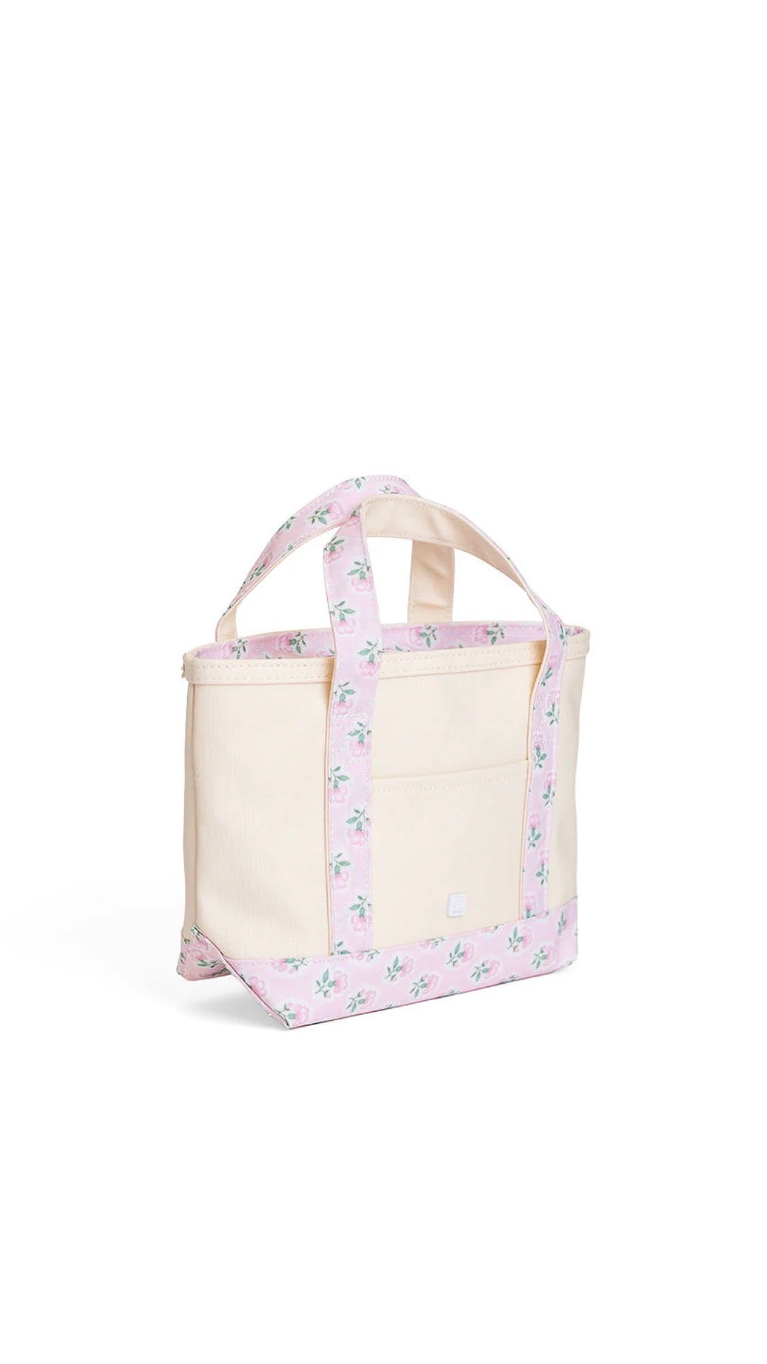 Natural coated canvas TRVL mini tote with pink petite fleur floral trim