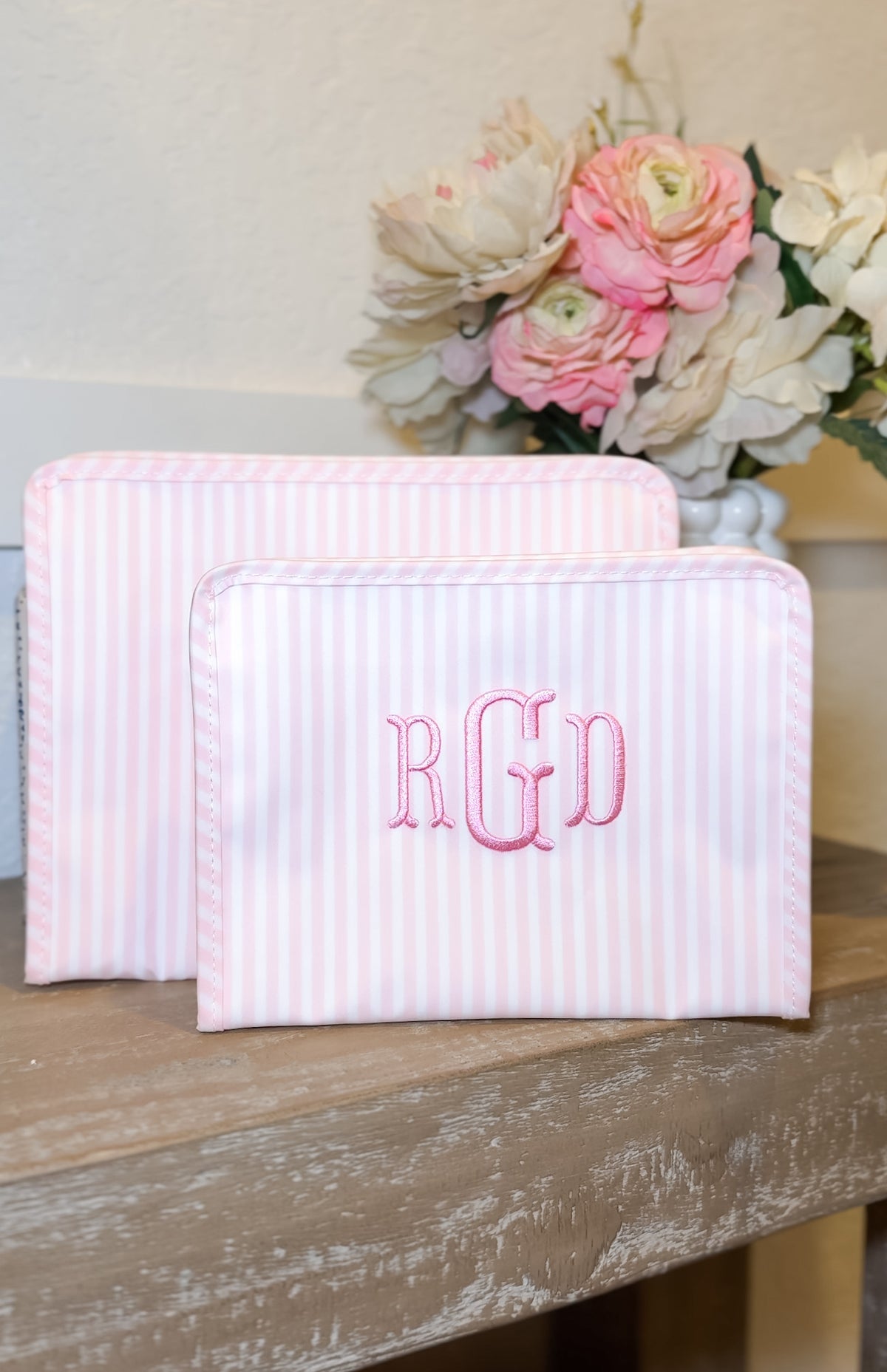 Pink Pimlico stripe TRVL Roadie pouch, available in medium and large