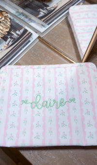 Pink ribbon floral roadie embroidered with the name Claire