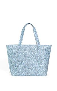 A blue Hamptons floral jumbo tote bag with two handles and a front exterior pocket.