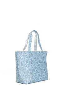 A blue Hamptons floral jumbo tote bag with two handles and a front exterior pocket.