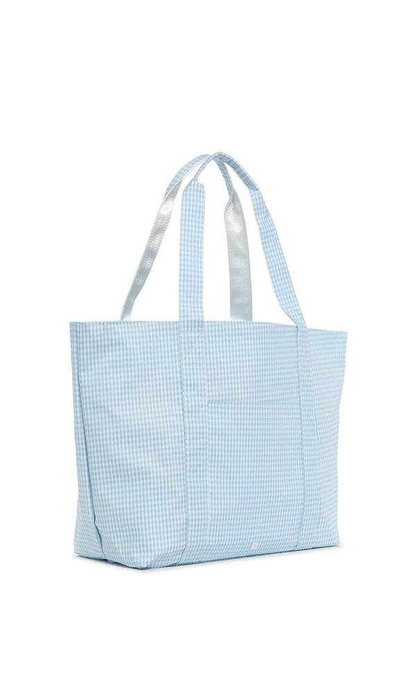 A blue gingham tote bag with a white zipper closure and satin webbing handles.