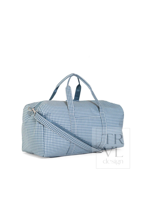 Indigo blue rodeo check XL weekender duffel bag, angled side view showing zipper closure and crossbody strap
